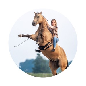 Yvet Blokesch sits on a horse that stands on its hind legs.