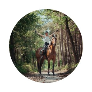 Yvet Blokesch goes for a ride in the forest and smiles.